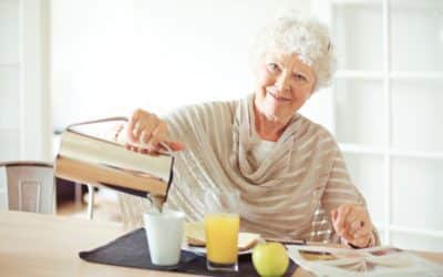 Elderly person pouring a cup of coffee