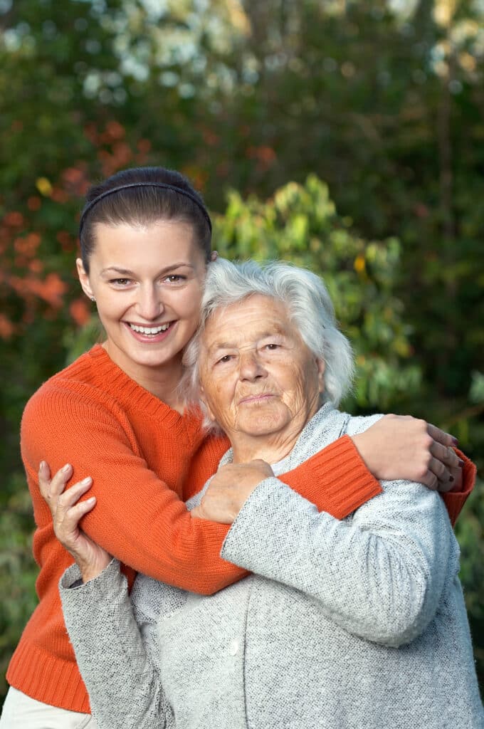 Heartwarming moment as young woman hugs her grandmother